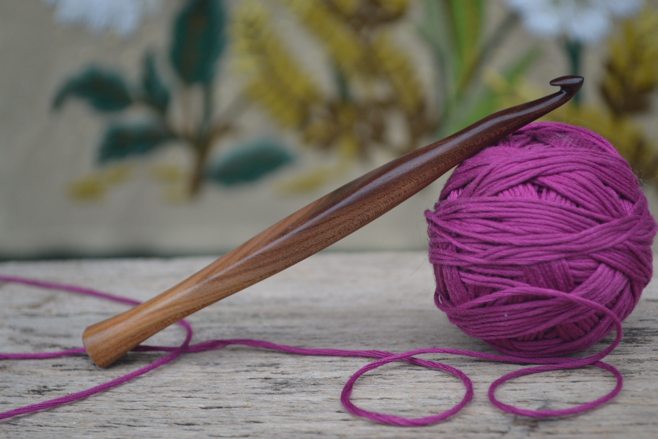 Handmade ergonomic crochet hook, flat shape, size 7, made of dark apricot wood, 15 cm long.