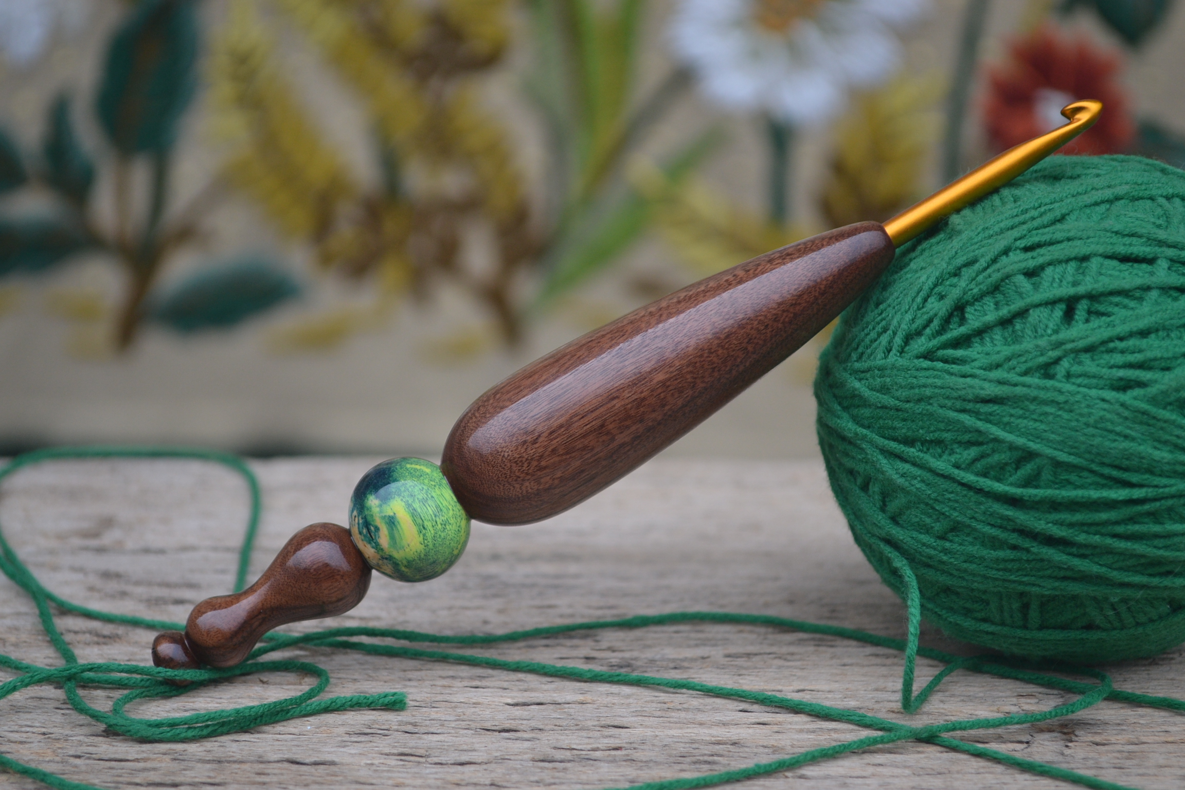 Handmade ergonomic crochet hook with Clover Soft Touch tip and stabilized maple burl inlay. Made of Rosewood Santos.