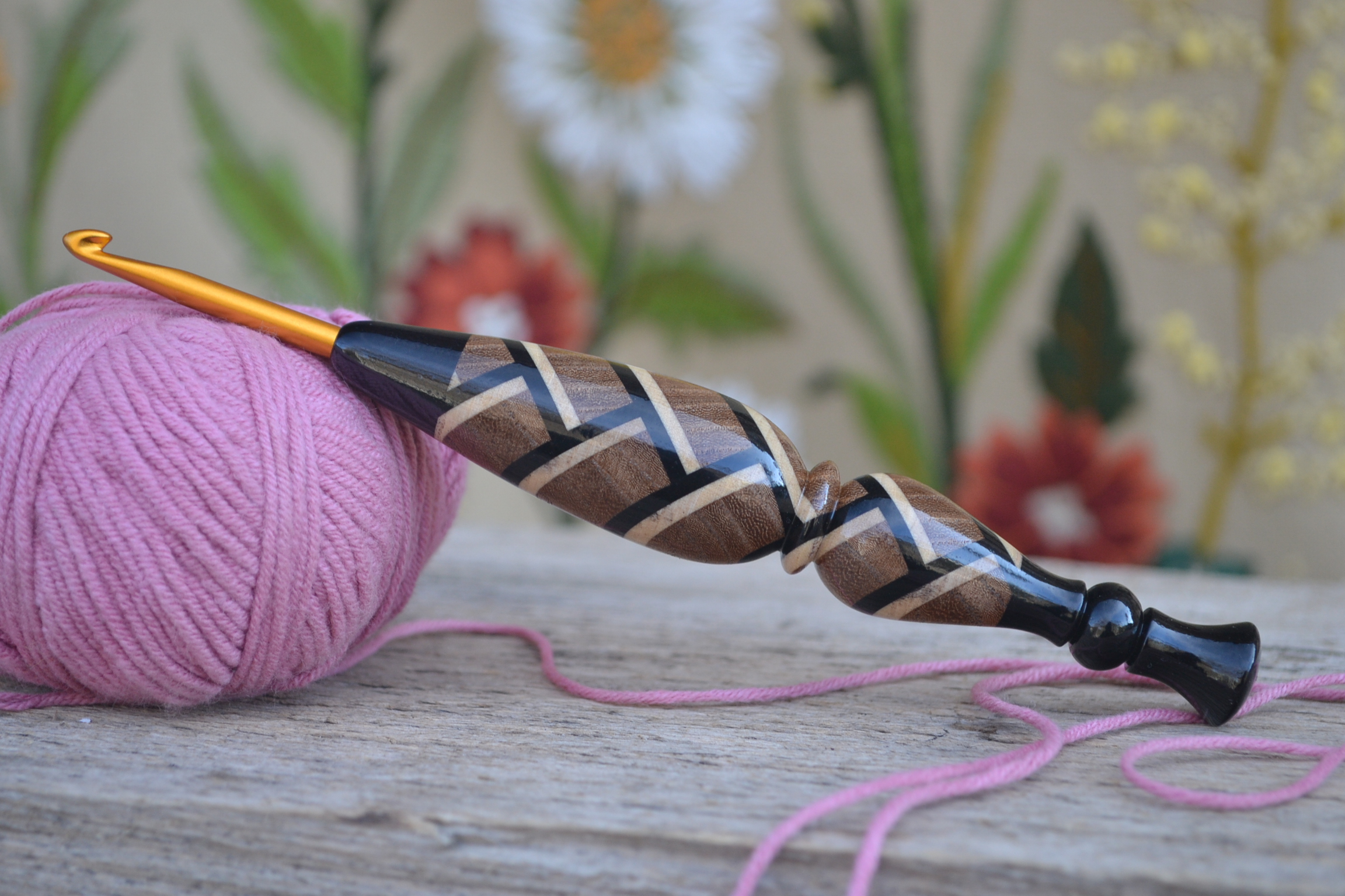 Handmade 4.5mm crochet hook with a mosaic wood handle, featuring elm, hornbeam, and black hornbeam.