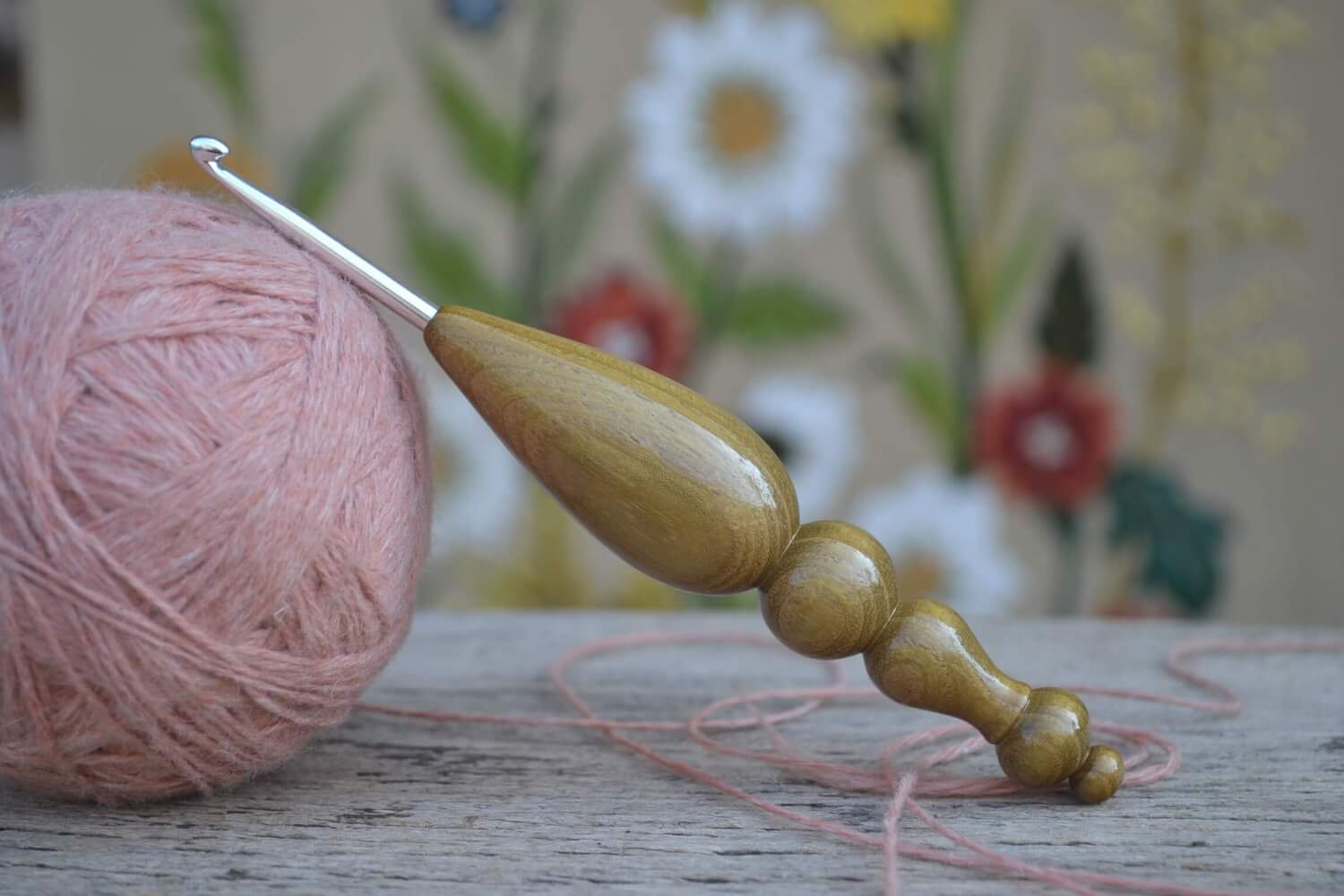 Handmade 4mm crochet hook with shimmering robinia wood handle and KnitPro tip
